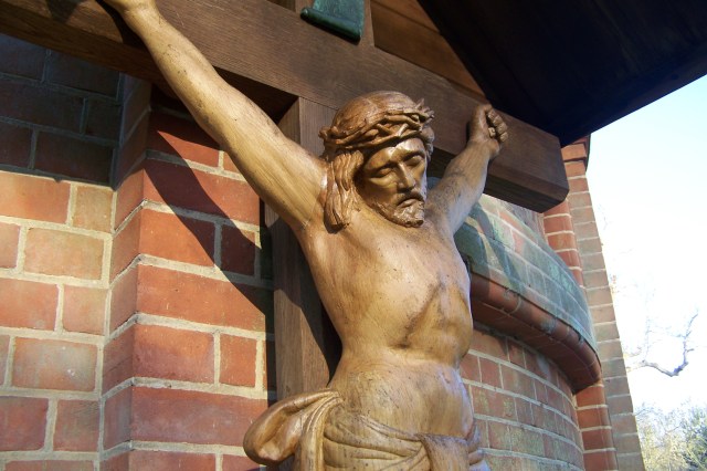 Detail of the crucifix, showing the lifelike quality of the carving.